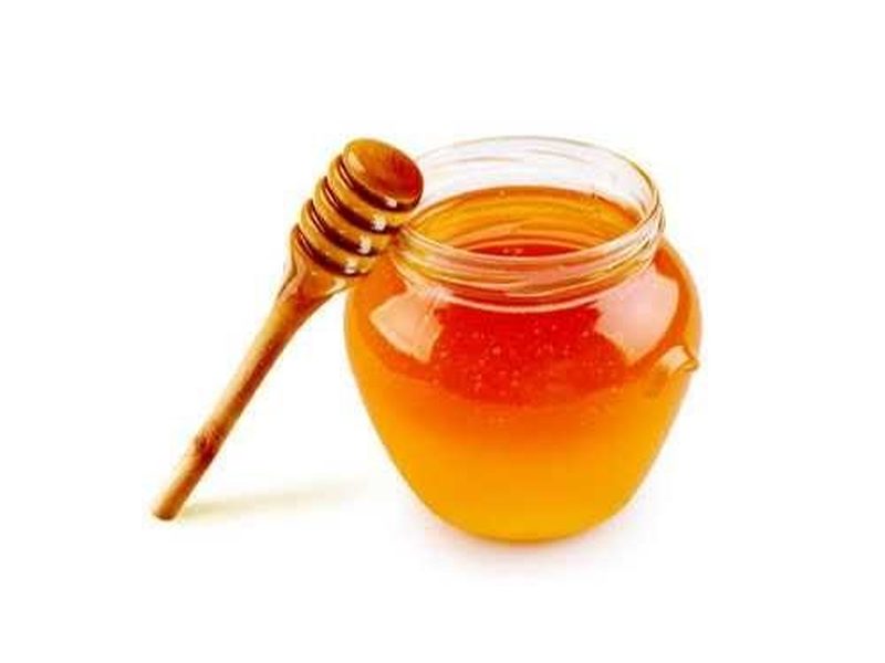Miel de abeja con cuchara